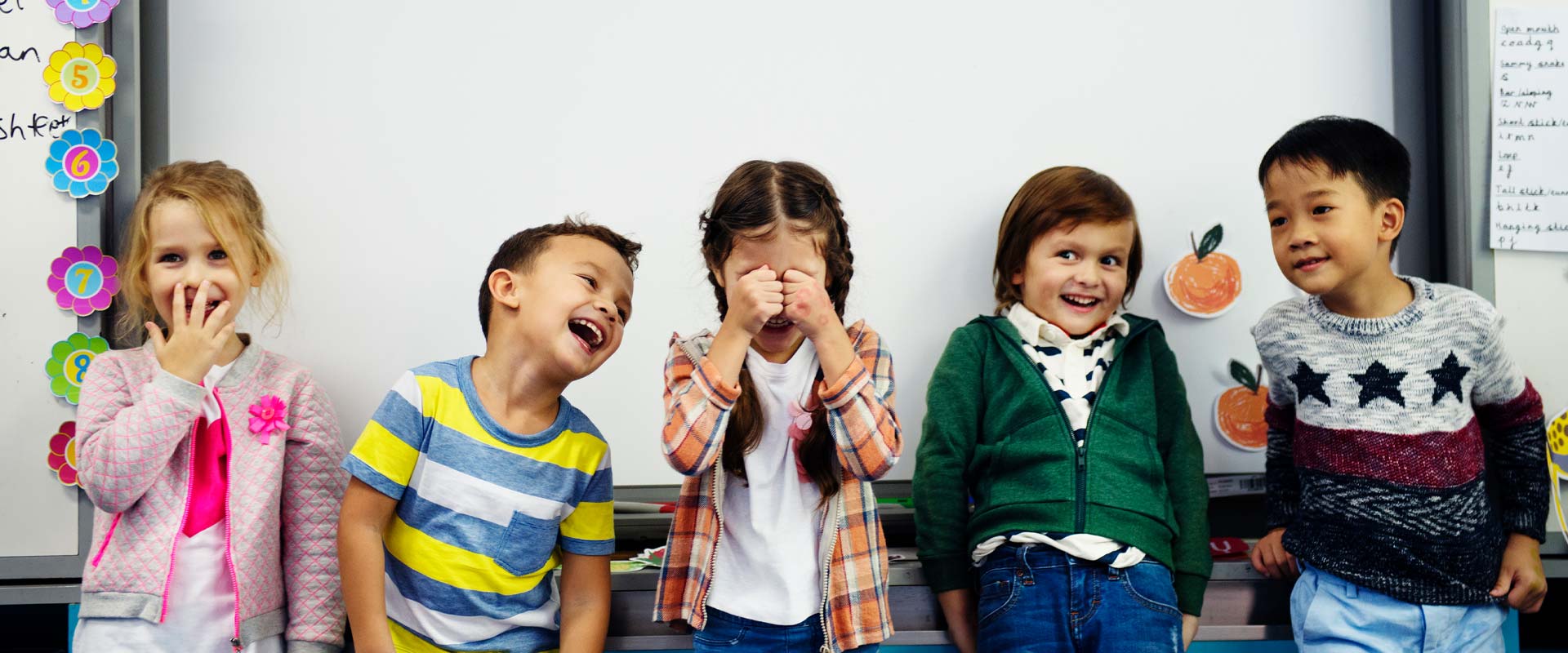 A group of school children laughing together